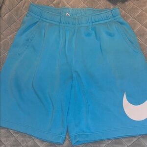 Nike baby blue Athletic Shorts with White Swoosh